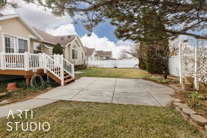 Exterior space with a patio and a fenced backyard