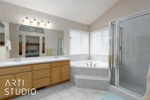 Ensuite bathroom with a sink, connected bathroom, tile patterned flooring, a bath, and vaulted ceiling