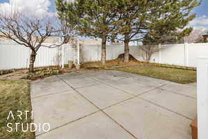 View of patio with a fenced backyard