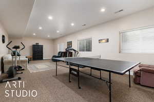 Playroom featuring recessed lighting, light colored carpet, and visible vents