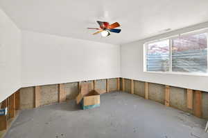 Unfurnished room with visible vents and concrete flooring