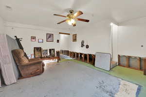 Interior space with visible vents, unfinished concrete flooring, and ceiling fan