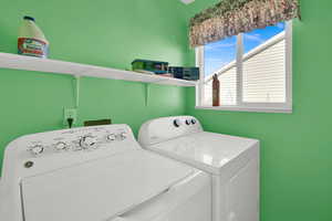 Laundry area featuring laundry area and separate washer and dryer