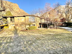 Back of house with central air condition unit