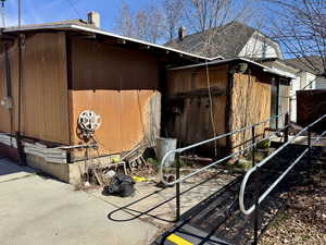 View of side of home with a chimney