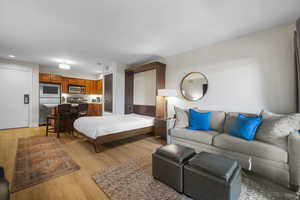 Living area featuring recessed lighting and light wood-style floors