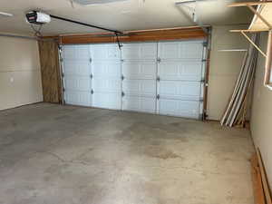 Garage featuring a garage door opener
