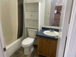 Full bath featuring vanity and toilet
