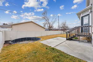 View of yard featuring a patio area and a fenced backyard