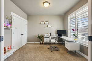 Office area featuring carpet flooring and baseboards