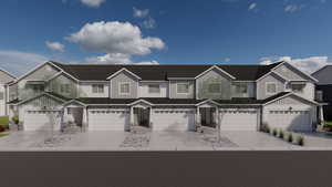 Multi unit property featuring board and batten siding, stone siding, and driveway