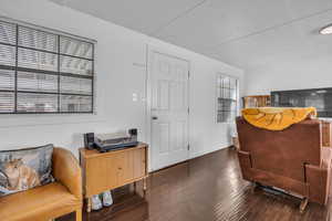 Interior space with dark wood-style floors and baseboards