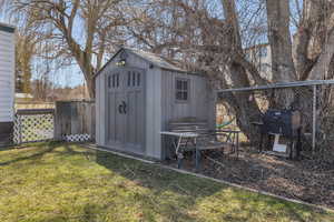 View of shed with fence