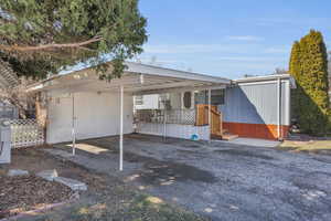 Exterior space with driveway and fence