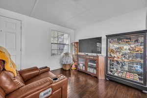 Living room featuring baseboards and wood finished floors