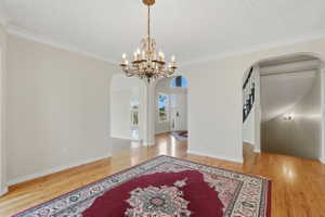 Formal dining room with entrance to kitchen, living room, and foyer