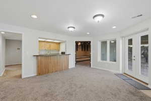 2nd kitchen off of the basement living room and theater room with a walkout entrance to covered patio