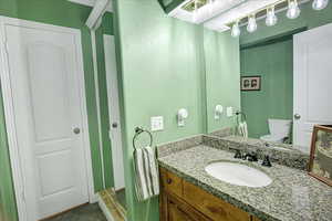 Bathroom with toilet and vanity