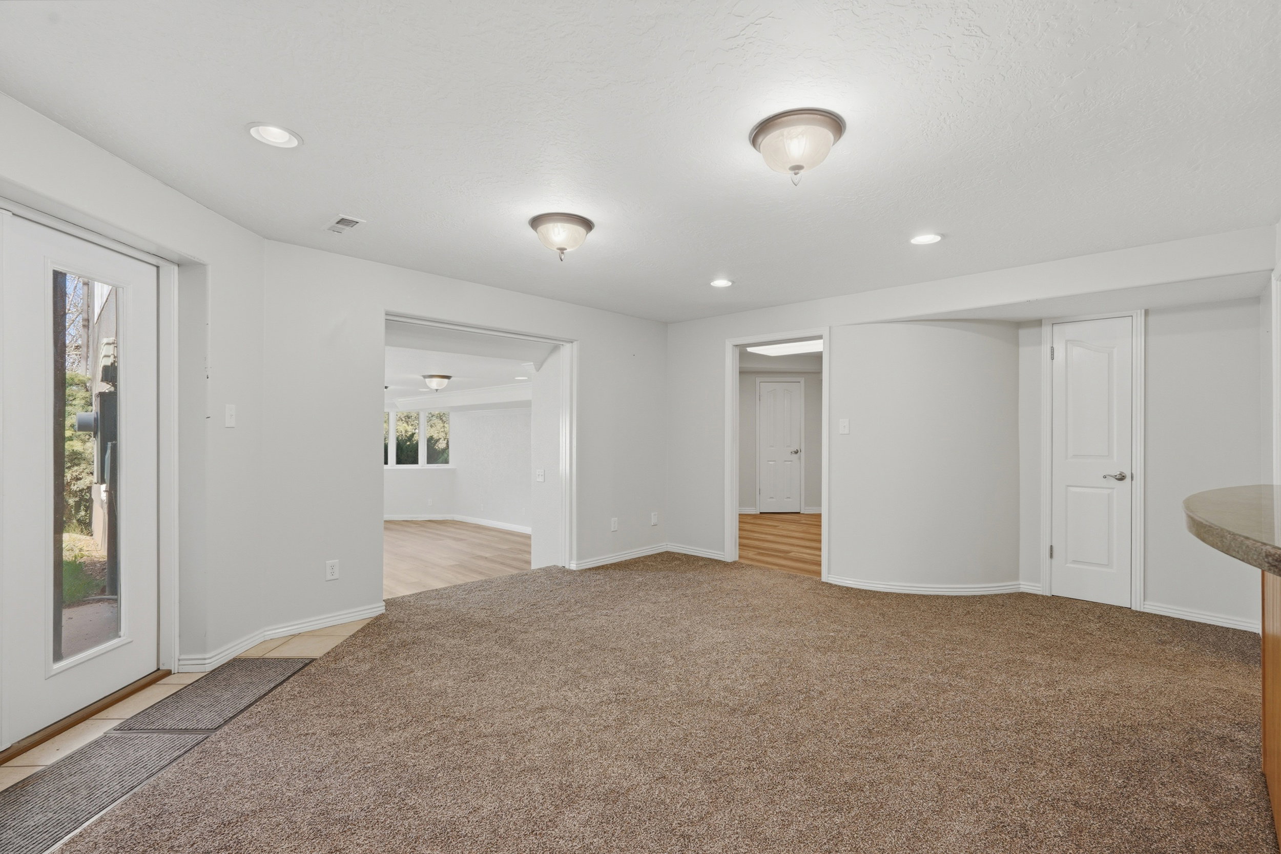 Open space between living room and second kitchen