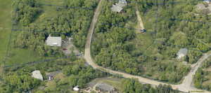 Aerial view featuring a view of trees