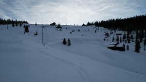 View of yard covered in snow