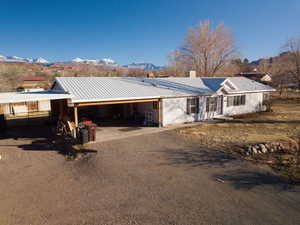 Ranch-style home with a mountain view and a garage