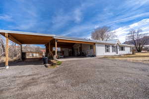 Exterior space with a carport and driveway