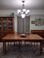 Dining space featuring an inviting chandelier