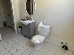 Bathroom with tile patterned flooring, toilet, and vanity plumbing available for bath/shower