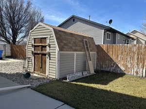 View of shed featuring a fenced backyard