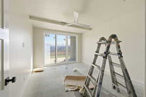 Workout room with baseboards and a ceiling fan