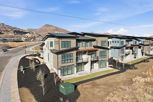 View of front facade featuring a residential view and a patio area
