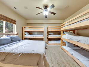 Unfurnished bedroom featuring visible vents, ceiling fan, and carpet floors