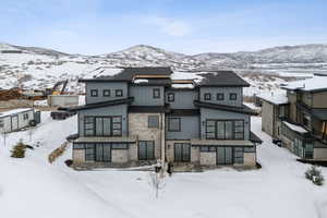 View of front of property featuring a mountain view and board and batten siding