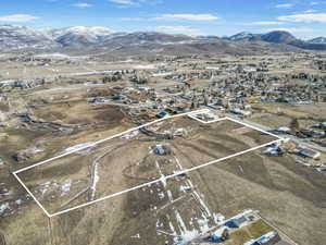 Birds eye view of property with a mountain view