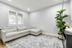 Living room featuring recessed lighting, baseboards, and wood finished floors