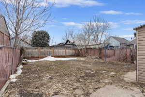 View of yard featuring a fenced backyard