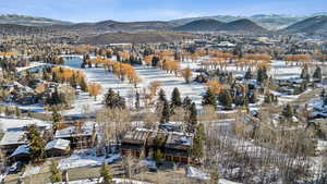 Snowy aerial view with a mountain view