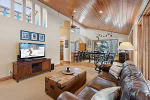 Living area with visible vents, ceiling fan, wood ceiling, and recessed lighting