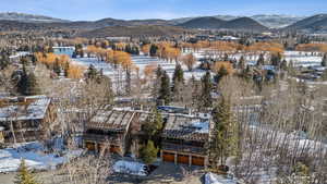 Snowy aerial view with a mountain view