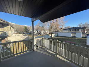 Balcony with a mountain view and an open backyard view
