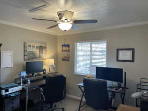 Office/2nd bedroom featuring ceiling fan,  textured ceiling, and mountain view