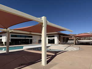 Community pool with a patio