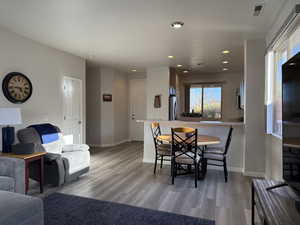 Dining room featuring visible vents, recessed lighting, light wood-type flooring, and baseboards