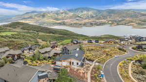 Aerial view of residential area featuring a water and mountain view