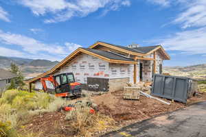 Property in mid-construction with a mountain view