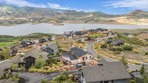 Aerial view of residential area featuring a water and mountain view