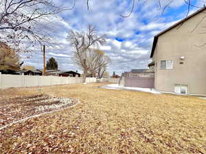 View of yard featuring a fenced backyard