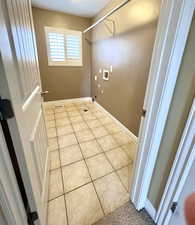 Laundry room with tile patterned floors, laundry area, hookup for a gas dryer, and washer hookup