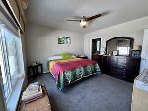 Bedroom featuring carpet flooring and a ceiling fan